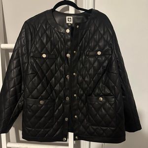 Women’s black quilted jacket.